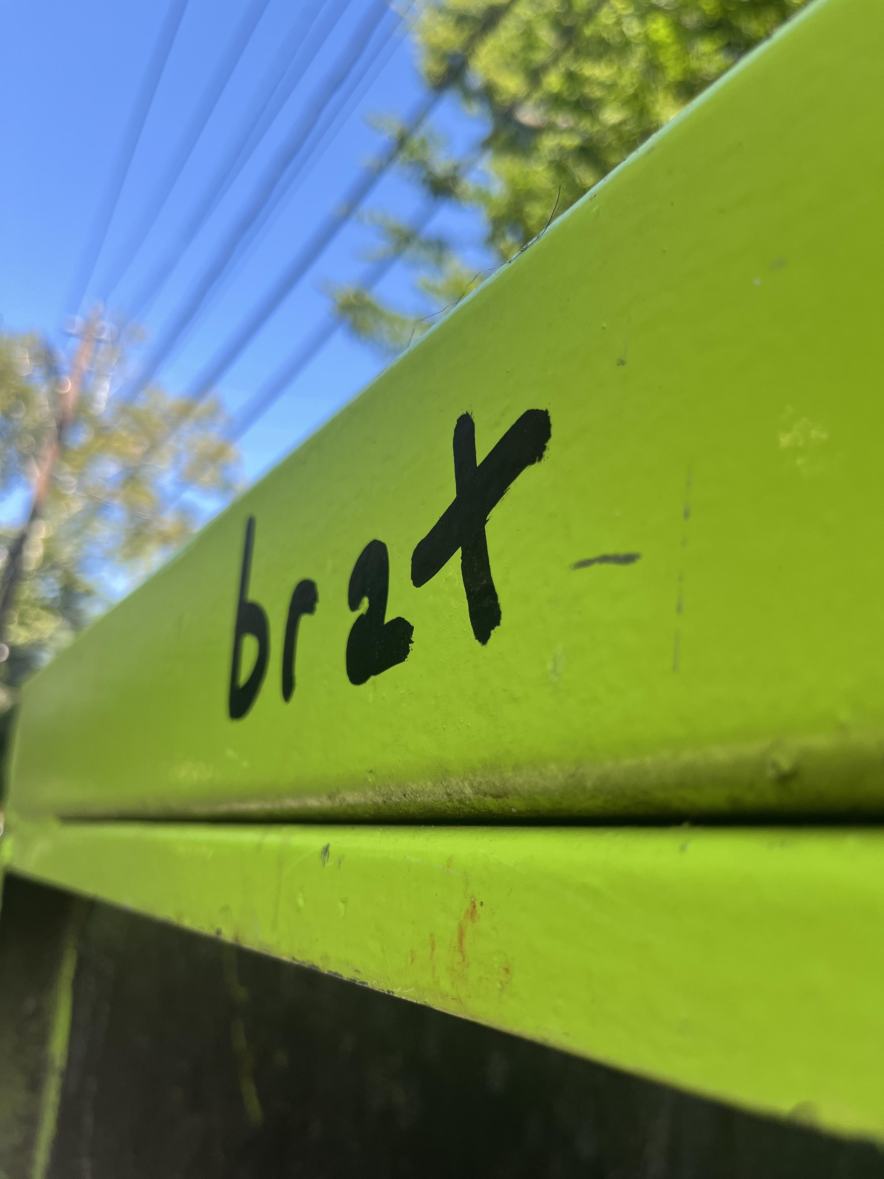 brat text on dumpster